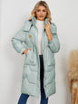 Women's long sleeve longline hooded winter coat by Trendsi, featuring a cozy, stylish design perfect for cold weather.