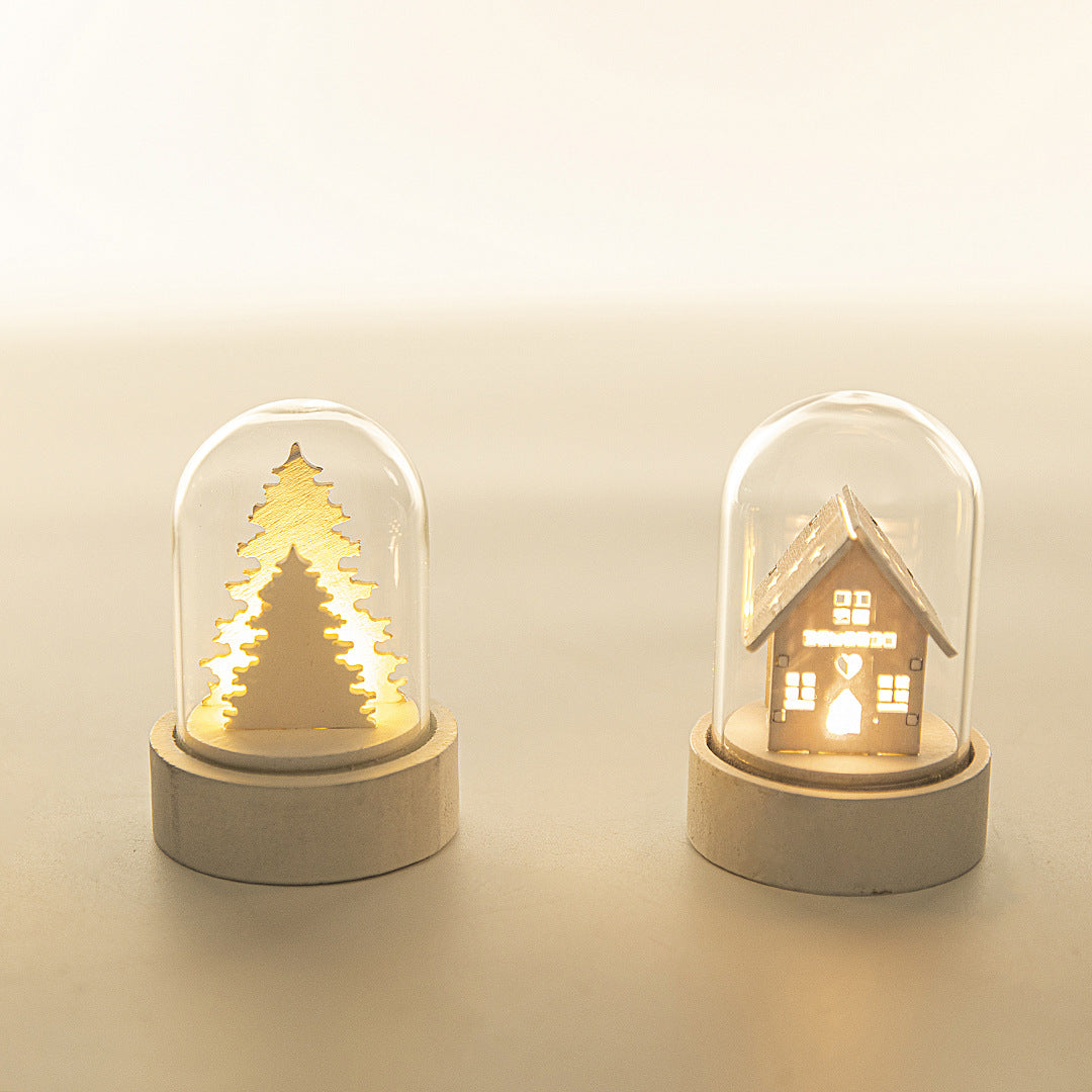 Luminous wooden house Christmas ornament decoration with warm glowing windows and festive details
