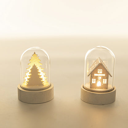 Luminous wooden house Christmas ornament decoration with warm glowing windows and festive details