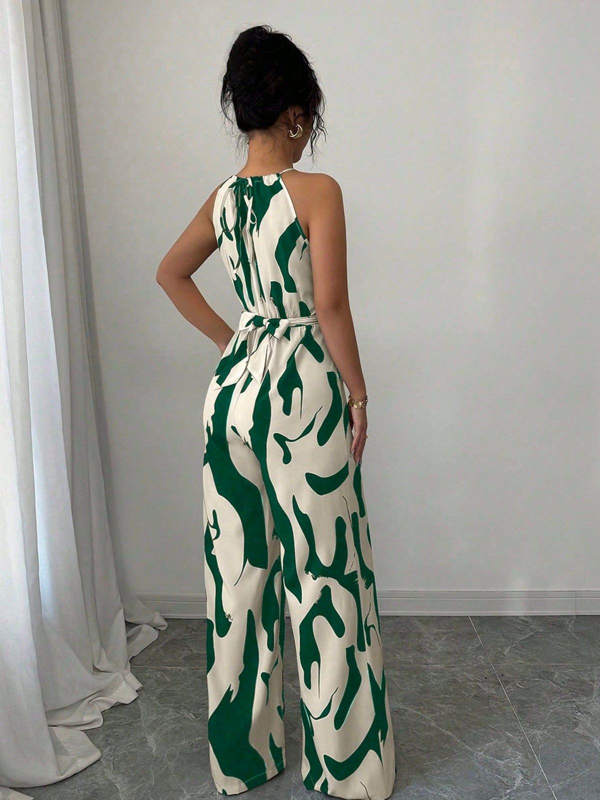 European American style milk-pattern halter neck jumpsuit with tie-back and open-back design for women
