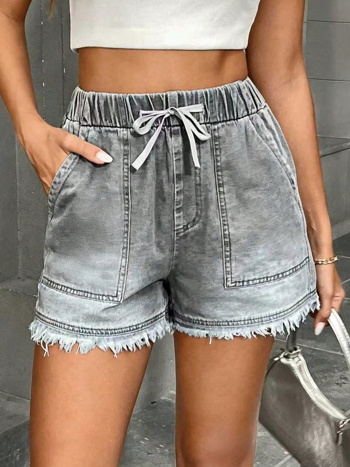 Women's denim shorts with elastic waist and drawstring waistband, front and back pockets