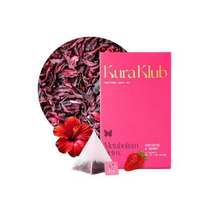 Kura Klub Green Tea with Hibiscus and Berry in a clear glass cup, showcasing vibrant red and green tea infusion.