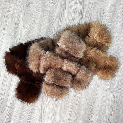 Segmented wool patches and plush materials cross-knitted into a mature, elegant coat with fur trim