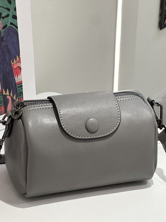 Urban minimalist leather shoulder and crossbody bag with versatile work desk organizer design