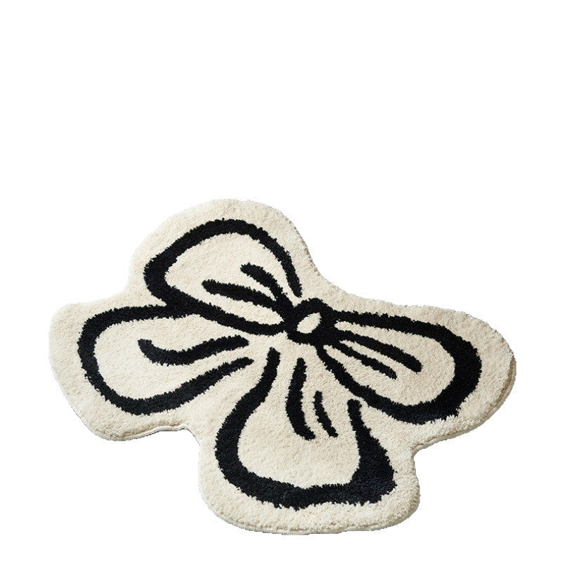 Thickened cold-proof imitation cashmere floor mat in a bow-shaped design