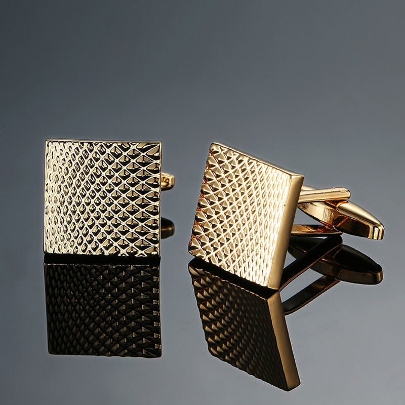 Copper black and golden silver laser metal cufflinks close-up