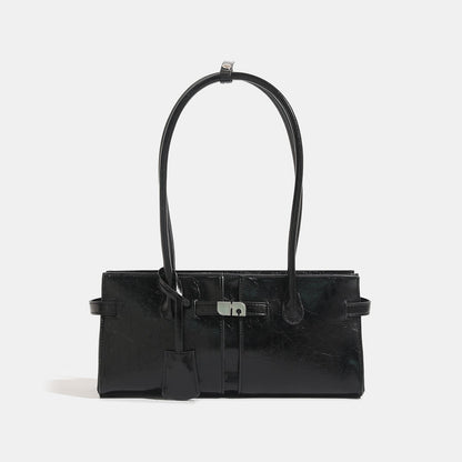 Women's versatile commuter handbag with luxurious feel and large capacity, structured design and top handles