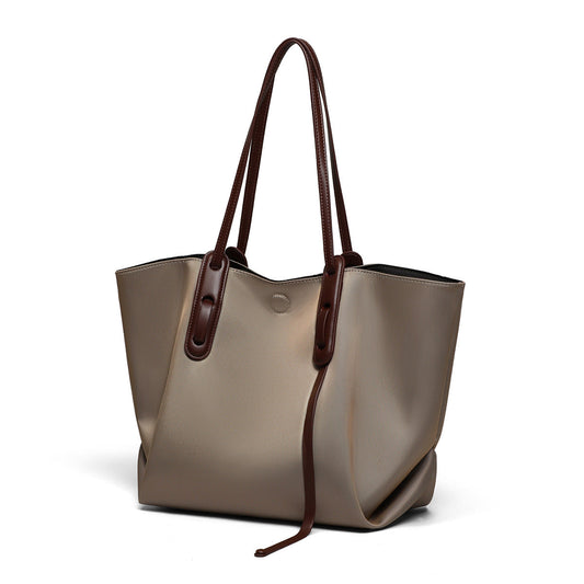 Women's high-end canvas tote bag with large capacity and shoulder strap, shown in a neutral color