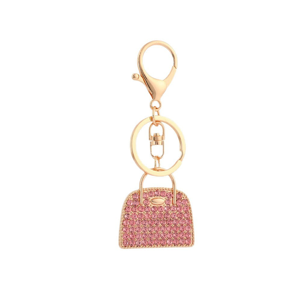 Creative minimalist diamond-studded handbag charm keychain in a sleek decorative design