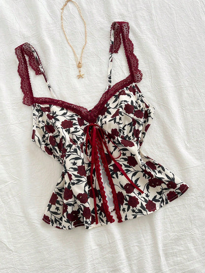 Lace-trimmed camisole with floral bow detail in a fashionable, versatile design