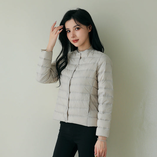 Women's lightweight white duck down jacket with quilted design and zip front