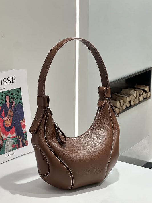 Soft leather cowhide underarm tote bag with spacious interior and crossbody strap