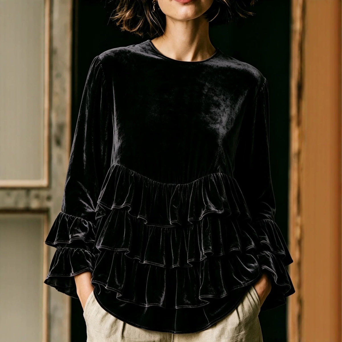 Women's long-sleeve solid-color crew-neck top with ruffle trim and loose fit