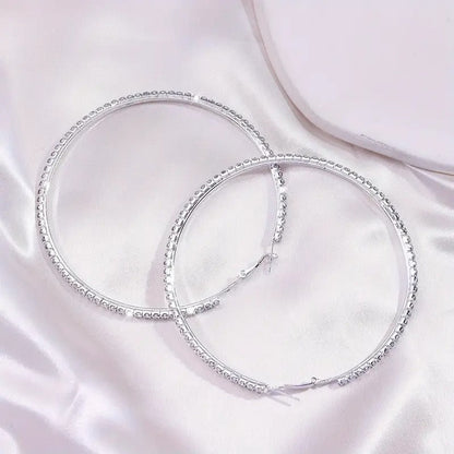 Large stainless steel gold hoop earrings with rhinestones, stylish bling jewelry for women, from DailySale.