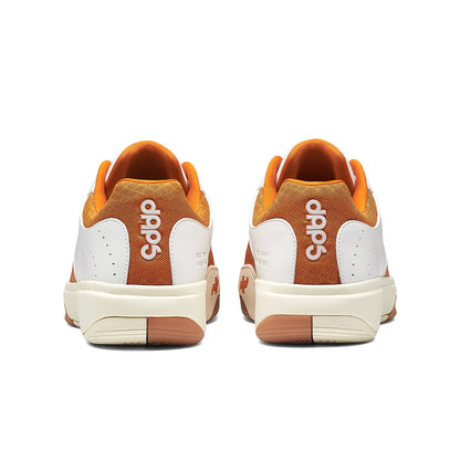 Women's DAPS DESI Low Pickleball Shoes in burnt orange by DAPSFIT, showing the stylish low-top design and textured sole.