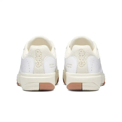 Women's DAPS DESI Low Pickleball Shoes by DAPSFIT in white and cream, featuring a sleek design and supportive sole.