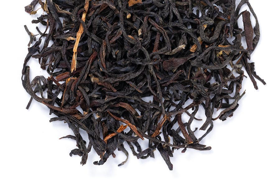 Loose leaf Darjeeling Sungma summer black tea from Novel Tea Book Shop, showing dried tea leaves in a close-up view.