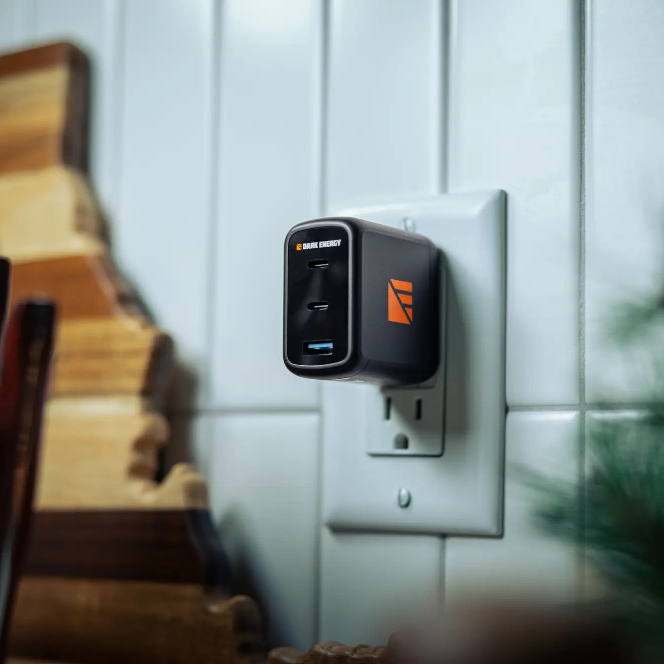 Dark Energy 65W AC wall adapter with compact design and multiple ports for versatile charging.