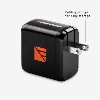 Dark Energy 65W AC wall adapter with prongs extended, compact power supply for electronic devices.