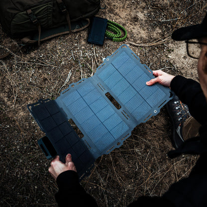 Dark Energy Spectre 18W solar panel showing a compact square solar panel with blue photovoltaic cells and black frame.