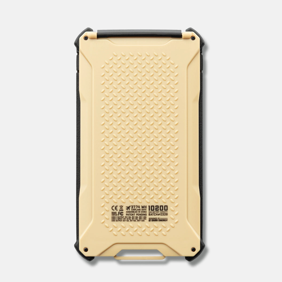 Dark Energy Poseidon Pro Power Bank portable charger in a desert landscape with a clear blue sky background.