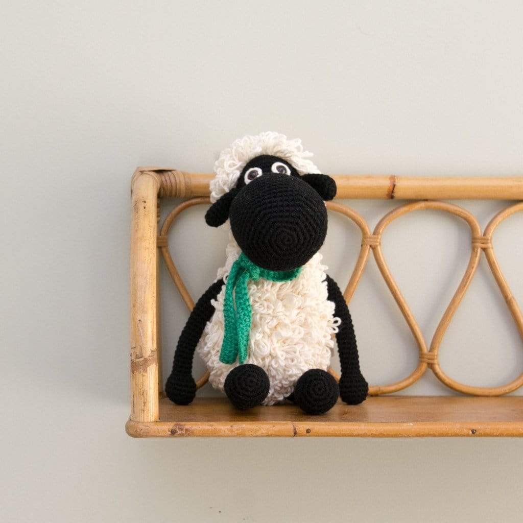 Black handmade Shelly the sheep stuffed animal by Bebemoss, made from organic cotton with detailed woolly texture.