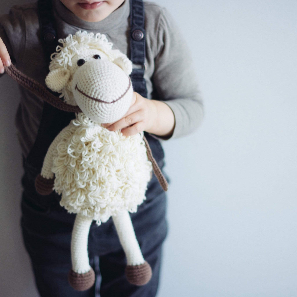 White handmade stuffed sheep named Darla by Bebemoss, made from organic cotton with soft, plush texture.