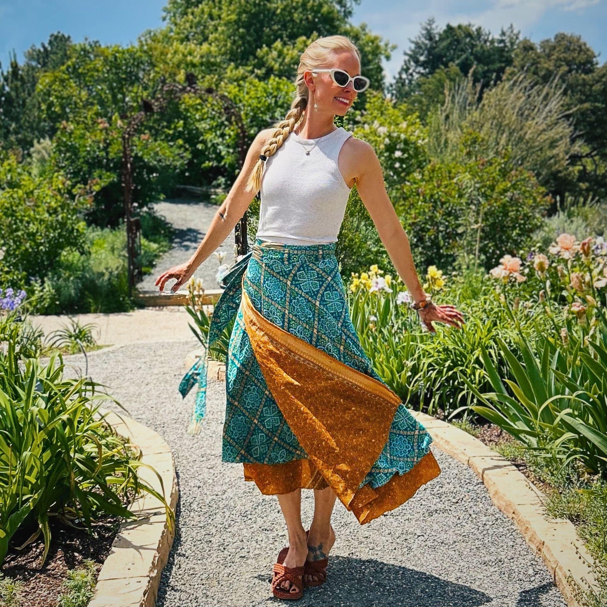 Darn Good Yarn The Original Sari Wrap Skirt in cool toning vibrant fabric, showcasing its flowy maxi design and intricate sari pattern.