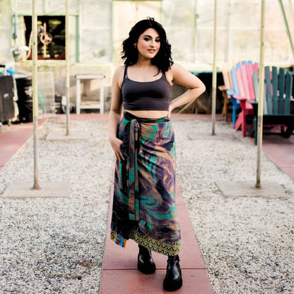 Darn Good Yarn The Original Sari Wrap Skirt in cool-tone fabric, flowing maxi length, casual boho style, vibrant sari pattern.