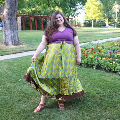 Darn Good Yarn The Original Sari Wrap Skirt in cool tones, flowing fabric, and vibrant sari patterns, styled as a boho maxi skirt.