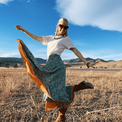 Darn Good Yarn The Original Sari Wrap Skirt in cool tones, flowing maxi clothing with vibrant sari fabric details.