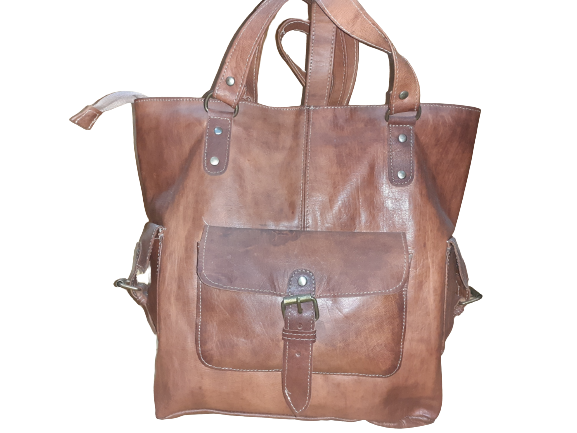 Handmade women's handbag with a shoulder strap, featuring detailed craftsmanship and stylish design.