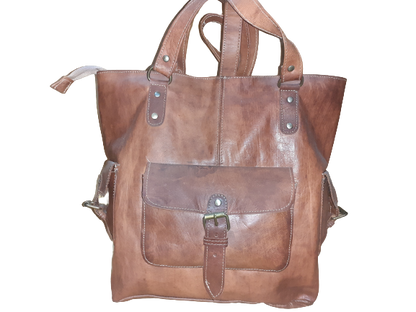 Handmade women's handbag with a shoulder strap, featuring detailed craftsmanship and stylish design.