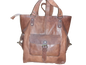 Handmade women's handbag with a shoulder strap, featuring detailed craftsmanship and stylish design.