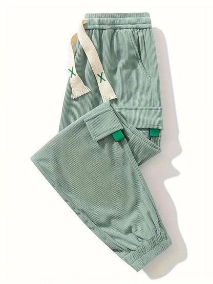 Corduroy plus size men's work pants with ankle tightening, shown in a tapered trouser style