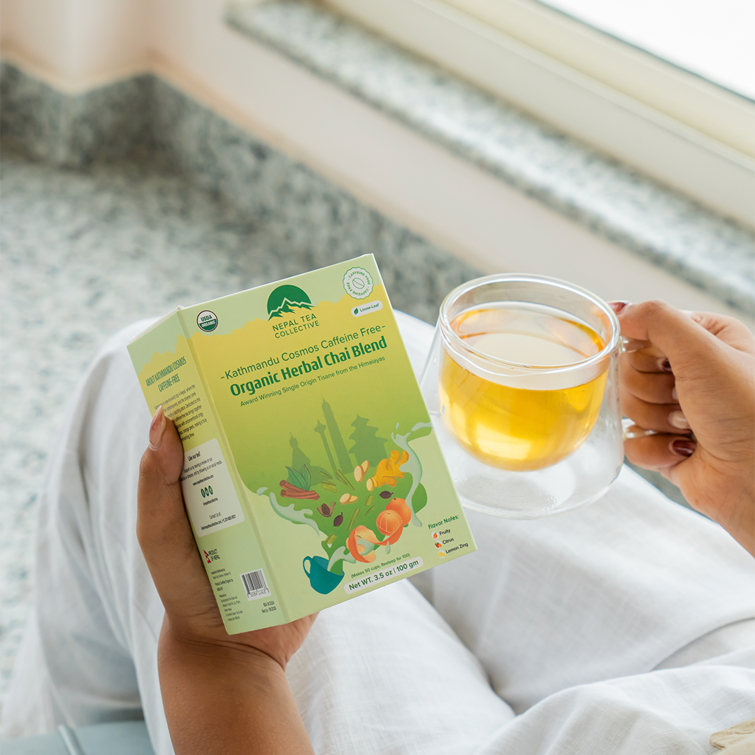 Organic Kathmandu Cosmos decaf tea blend by Nepal Tea, featuring a colorful and aromatic package with natural tea leaves.