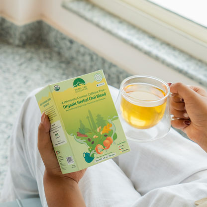 Organic Kathmandu Cosmos decaf tea blend by Nepal Tea, featuring a colorful and aromatic package with natural tea leaves.