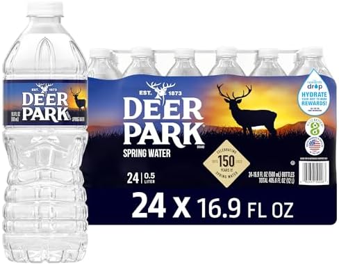 Deer Park Spring Water 24-pack, 16.9 fl oz bottles, natural spring water with crisp refreshing taste, stacked in a retail display.