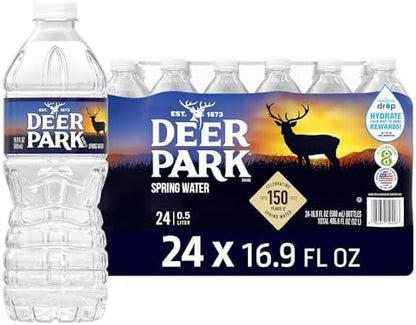 Deer Park Spring Water 24-pack, 16.9 fl oz bottles, natural spring water with crisp refreshing taste, stacked in a retail display.