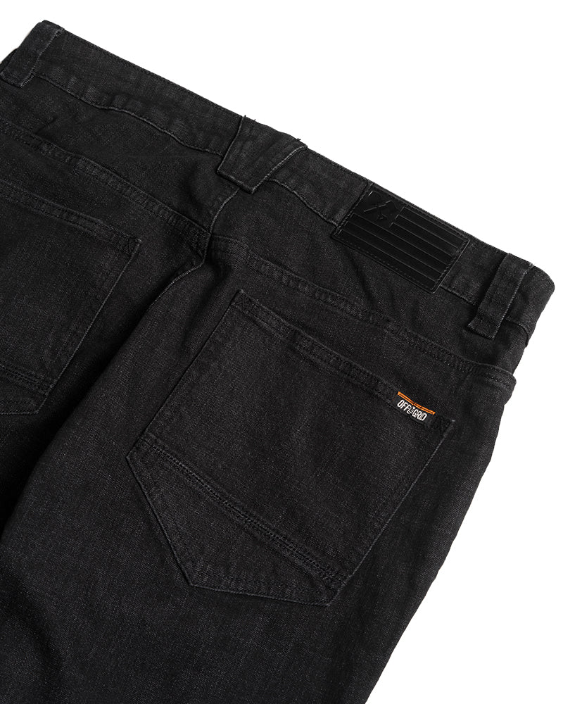 Black denim taper fit pants by Off The Grid Surplus, featuring a stylish, slim silhouette and classic denim texture.