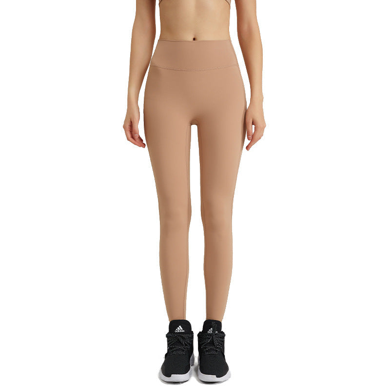 Women's high-waisted butt-lifting yoga pants with seamless design 񟿿