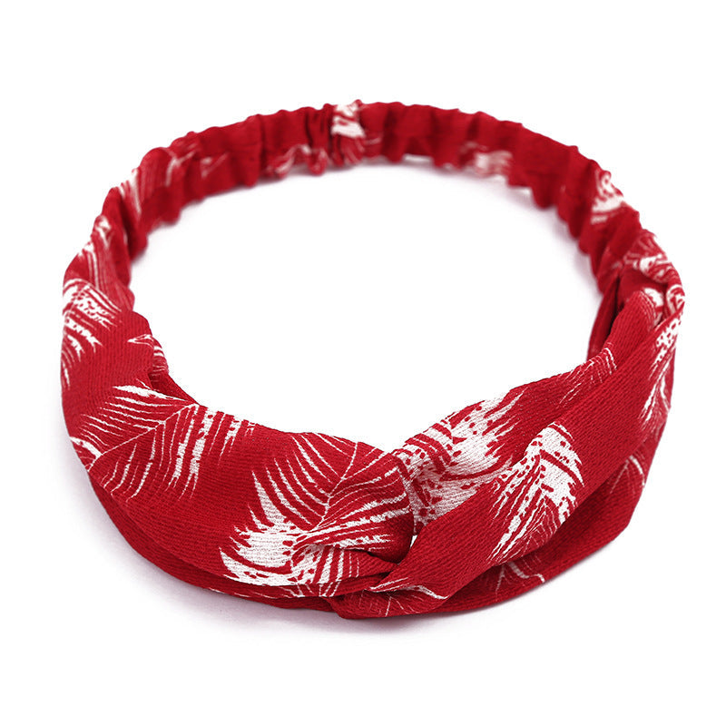 Women's retro style printed headband with colorful pattern on a white background