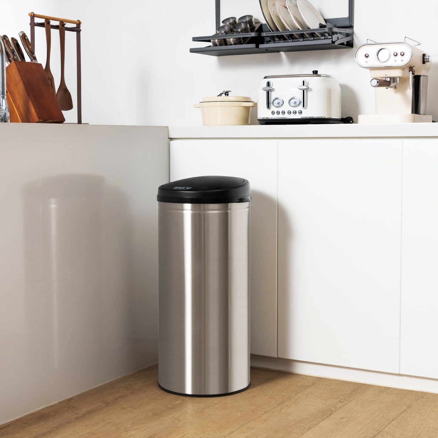 Silver 8-gallon automatic trash can with stainless steel frame and touchless operation, designed for convenient waste disposal.