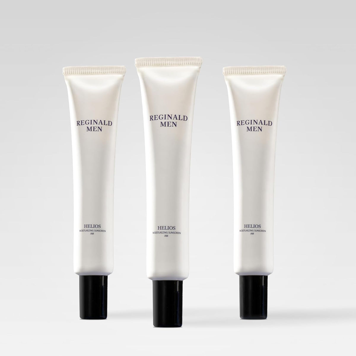 Dista Reginald Men Sunscreen SPF 50 PA++++ in 50g tube, featuring brightening and moisturizing benefits for men's skincare.