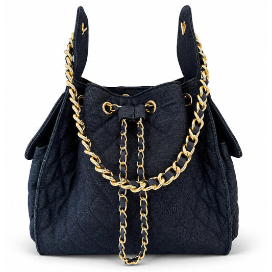 Medium Bayshore Bucket Bag by BEACH HAUS in dark wash denim, featuring a casual, stylish design with sturdy straps and spacious interior.