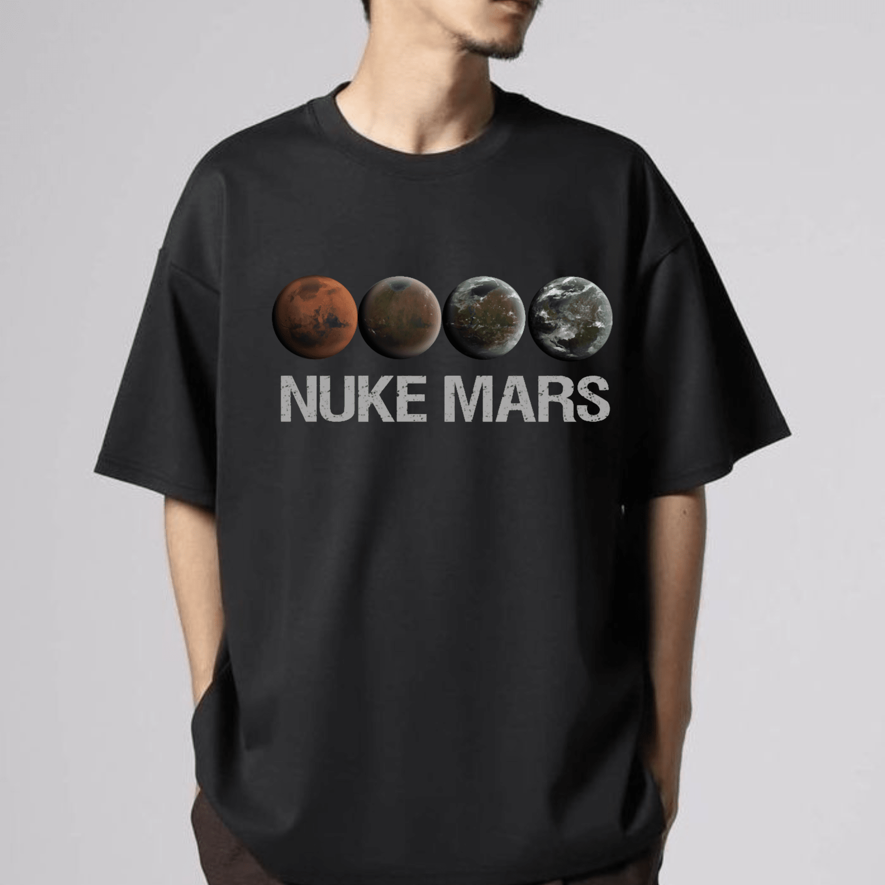 Black Nuke Mars Essential T-Shirt by Dog Mom Hat featuring SpaceX-inspired design with Elon Musk and Mars imagery.