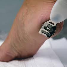 Tweezerman Safety Slide Callus Shaver and Rasp, a foot care tool with a safety design for removing calluses and smoothing skin.