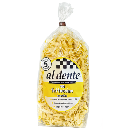 Al Dente Pasta Egg Fettuccine from Duo Grocery, uncooked yellow pasta noodles arranged in a bundle on a white background.