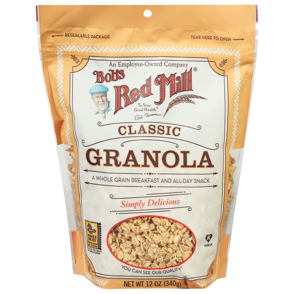 Bowl of Bob's Red Mill Classic Granola with oats, nuts, and dried fruit on a white background.