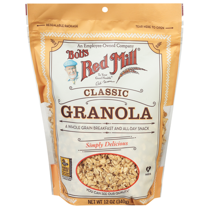 Bowl of Bob's Red Mill Classic Granola with oats, nuts, and dried fruit on a white background.